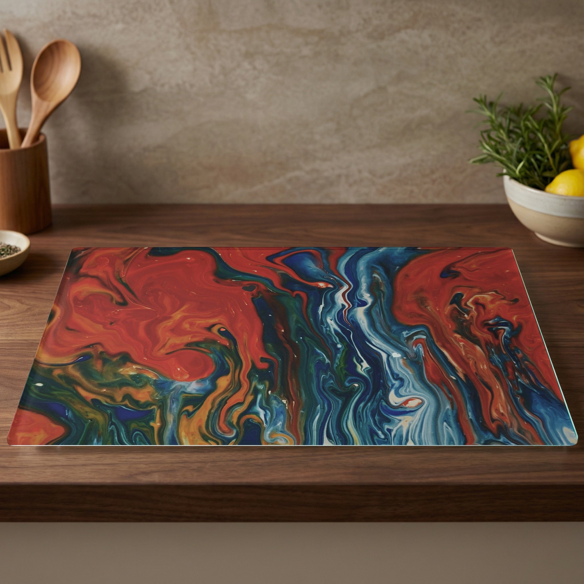 Tempered glass cutting board with vibrant blue, red, and gold abstract marbling.